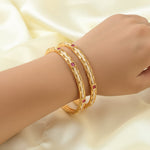 Load image into Gallery viewer, Set Of 4 Gold Plated Artificial Stone Studded & Beaded Bangles