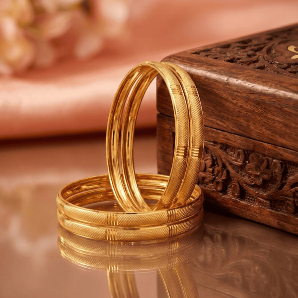 Set Of 4 Gold-Plated Cut Work Plane Design Bangles