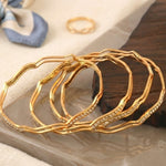 Load image into Gallery viewer, Set Of 4 Gold-Plated AD-Studded Bangles
