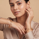 Load image into Gallery viewer, Set of 2 Gold-Toned &amp; American Diamond  Stone-Studded Contemporary Open-Work Bangles
