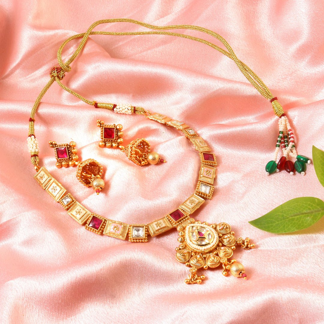 Antique matte gold-plated choker with floral pendant and pastel enamel detailing