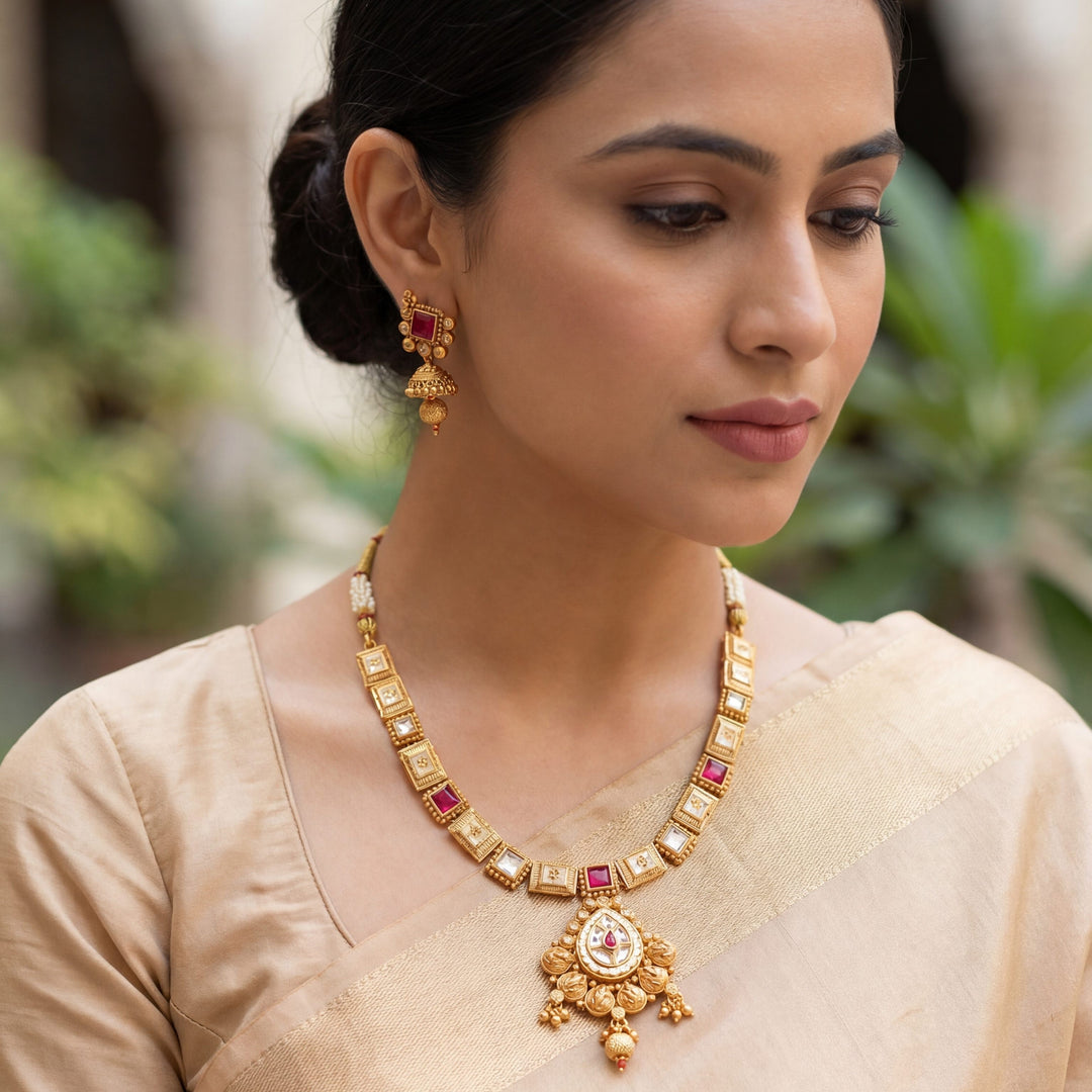Antique matte gold-plated choker with floral pendant and pastel enamel detailing