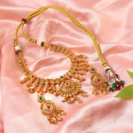 Load image into Gallery viewer, Ethnic temple-style matte gold plated necklace set with ruby red &amp; emerald Dark Green stones.
