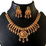 Load image into Gallery viewer, Ethnic temple-style matte gold plated necklace set with ruby red &amp; emerald Dark Green stones.
