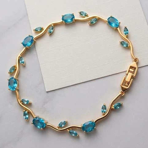 18K Gold Plated Floral Vine Bracelet with Teal Blue Crystals and Clear Marquise Leaves